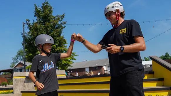 A coach encouraging his camper