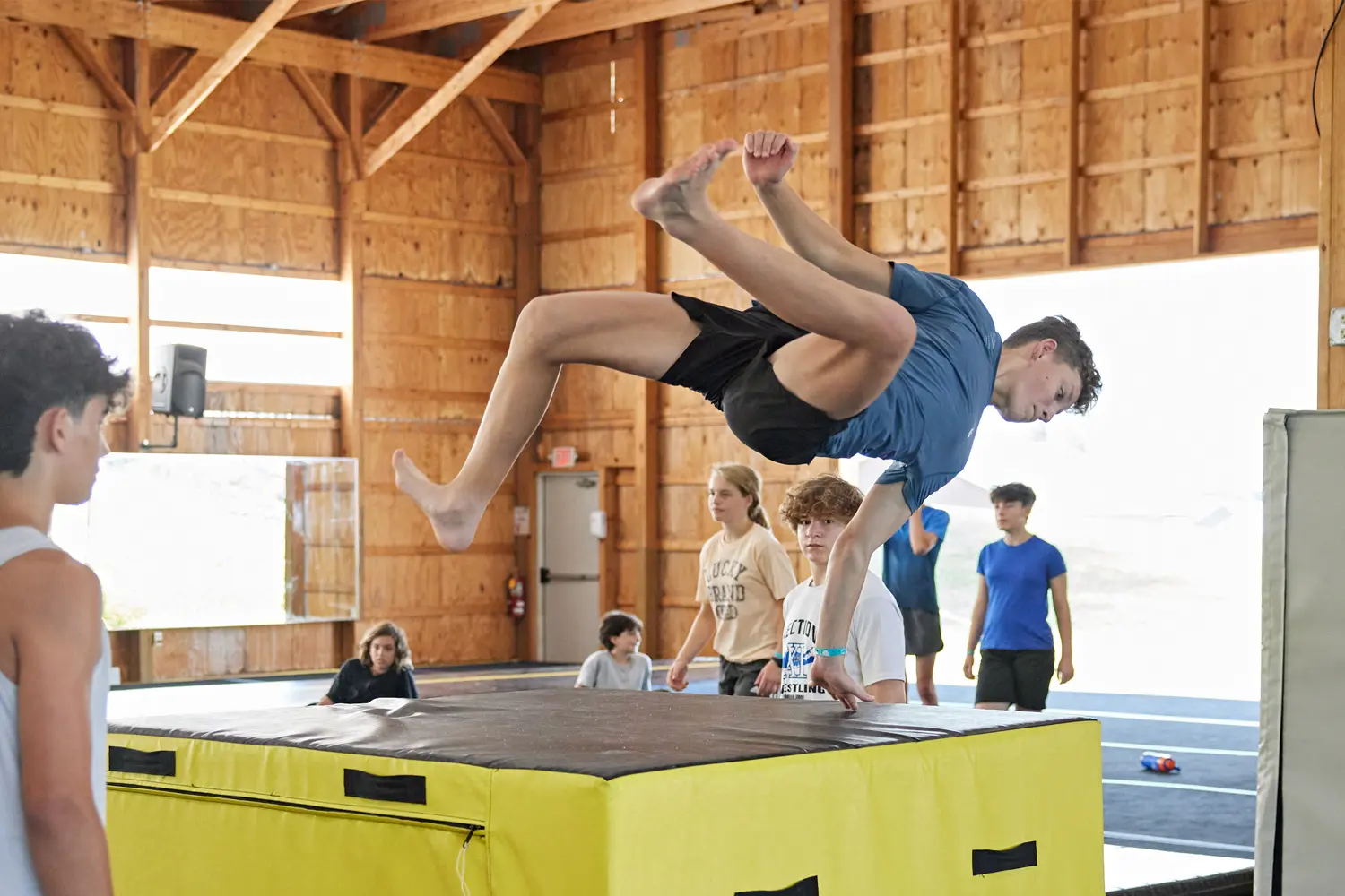 Parkour Camper practicing his flips in our gym